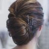 Voluminous Chignon Wedding Hairstyles With Twists (Photo 2 of 25)
