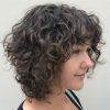 Layered Curly Medium Length Hairstyles (Photo 18 of 25)