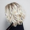 Pearl Blonde Bouncy Waves Hairstyles (Photo 23 of 25)