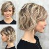 Curly Ash Blonde Updo Hairstyles With Bouffant And Bangs (Photo 8 of 25)
