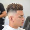 Mohawk Haircuts On Curls With Parting (Photo 9 of 25)