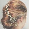Sleek Bridal Hairstyles With Floral Barrette (Photo 16 of 25)