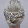 Large Curly Bun Bridal Hairstyles With Beaded Clip (Photo 22 of 25)