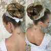 Bridal Mid-Bun Hairstyles With A Bouffant (Photo 17 of 25)