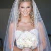 Curly Bridal Bun Hairstyles With Veil (Photo 6 of 25)