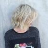 Curly Angled Blonde Bob Hairstyles (Photo 16 of 25)