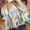Curly Angled Blonde Bob Hairstyles (Photo 8 of 25)