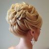 Large Curly Bun Bridal Hairstyles With Beaded Clip (Photo 16 of 25)