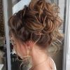 Large Curly Bun Bridal Hairstyles With Beaded Clip (Photo 7 of 25)