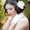 Veiled Bump Bridal Hairstyles With Waves (Photo 16 of 25)