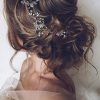 Undone Low Bun Bridal Hairstyles With Floral Headband (Photo 18 of 25)