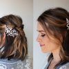Sleek Bridal Hairstyles With Floral Barrette (Photo 15 of 25)