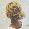 Wavy Low Bun Bridal Hairstyles With Hair Accessory (Photo 7 of 25)