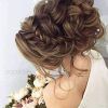 Voluminous Chignon Wedding Hairstyles With Twists (Photo 25 of 25)