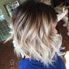 Dark Roots And Icy Cool Ends Blonde Hairstyles (Photo 8 of 25)