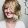 Soft Layers And Side Tuck Blonde Hairstyles (Photo 7 of 25)