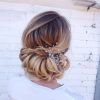 Large Curly Bun Bridal Hairstyles With Beaded Clip (Photo 17 of 25)