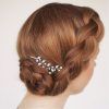 Large Curly Bun Bridal Hairstyles With Beaded Clip (Photo 25 of 25)