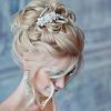 Large Bun Wedding Hairstyles With Messy Curls (Photo 22 of 25)