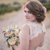 Bohemian Curls Bridal Hairstyles With Floral Clip (Photo 24 of 25)