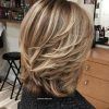 Feathered Cut Blonde Hairstyles With Middle Part (Photo 16 of 25)