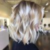 Pearl Blonde Bouncy Waves Hairstyles (Photo 2 of 25)