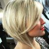 Feathered Haircuts With Angled Bangs (Photo 9 of 25)