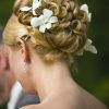 Curly Wedding Hairstyles With An Orchid (Photo 4 of 25)