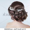 Curly Wedding Updos With Flower Barrette Ties (Photo 15 of 25)