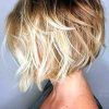 Curly Angled Blonde Bob Hairstyles (Photo 23 of 25)
