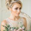 Curly Bridal Bun Hairstyles With Veil (Photo 4 of 25)