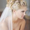 Curly Bridal Bun Hairstyles With Veil (Photo 5 of 25)