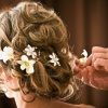 Curly Wedding Hairstyles With An Orchid (Photo 7 of 25)
