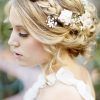 Undone Low Bun Bridal Hairstyles With Floral Headband (Photo 17 of 25)