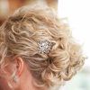 Curly Wedding Updos With Flower Barrette Ties (Photo 3 of 25)