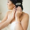 Sleek Bridal Hairstyles With Floral Barrette (Photo 25 of 25)