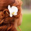 Curly Wedding Hairstyles With An Orchid (Photo 9 of 25)