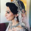 Curly Bridal Bun Hairstyles With Veil (Photo 21 of 25)