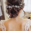 Chignon Wedding Hairstyles With Pinned Up Embellishment (Photo 2 of 25)