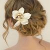 Curly Wedding Hairstyles With An Orchid (Photo 3 of 25)