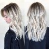 Dark Roots And Icy Cool Ends Blonde Hairstyles (Photo 13 of 25)