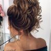 Large Bun Wedding Hairstyles With Messy Curls (Photo 10 of 25)