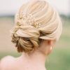 Undone Low Bun Bridal Hairstyles With Floral Headband (Photo 4 of 25)