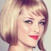 Feathered Cut Blonde Hairstyles With Middle Part (Photo 20 of 25)