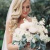 Side Curls Bridal Hairstyles With Tiara And Lace Veil (Photo 25 of 25)