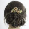 Side Bun Prom Hairstyles With Jewelled Barrettes (Photo 16 of 25)