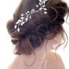 Messy Bun Prom Hairstyles With Long Side Pieces (Photo 14 of 25)