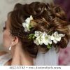 Curly Wedding Updos With Flower Barrette Ties (Photo 21 of 25)