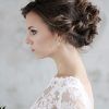 Bridal Mid-Bun Hairstyles With A Bouffant (Photo 24 of 25)