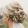 Curly Bridal Bun Hairstyles With Veil (Photo 10 of 25)